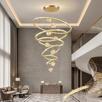 Lustre LED moderne de luxe multi-anneaux en cristal, intensité variable en 3 couleurs, suspension en acier inoxydable pour villa à plafond haut