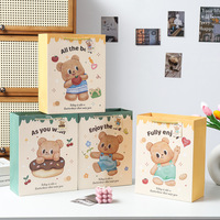Sac cadeau en papier de texture ours beurre dessin animé haut niveau d'apparence emballage cadeau d'anniversaire sac en papier sac à main souvenir
