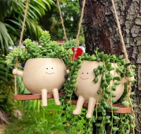 Jardinière suspendue durable avec finition en résine vernie et motif visage souriant mignon sur balançoire pour la maison et le jardin