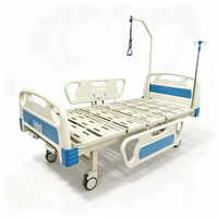 Lit médical manuel à 2 manivelles pour hôpital, avec 2 barrières latérales en ABS et roulettes