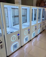 Vente en gros Nouveauté Distributeur automatique de jouets en métal à monnayeur avec interface en anglais, pour capsules surprise, personnalisable 110/220V