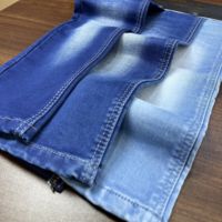Tela vaquera de sarga pesada Lizhi LT-INDIGO, tejido elástico de poliéster, algodón y spandex para chaquetas vaqueras, jeans y bolsos de hombre y mujer