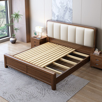 Lit double moderne et simple en bois massif couleur noyer, nouveau style chinois, pour chambre principale, avec tête de lit capitonnée en cuir et rangement intégré.