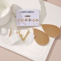Femmes mode surdimensionné métal cercle coeur Punk boucles d'oreilles ensemble torsadé grande perle avec coquille pierre bijoux en gros