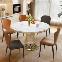 Table à manger ronde moderne de 51 "avec dessus en marbre et piédestal en acier inoxydable doré pour 6 places dans le salon salle à manger hôtel