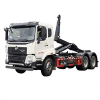 Camion compacteur diesel Sinotruk Howo à double essieu arrière avec bras de ramassage, camion à ordures de 25 tonnes, chargeur de déchets