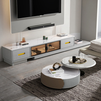 Ensemble de meubles TV en marbre avec étagère vitrée, portes coulissantes à lumière chaude, tiroirs de rangement et tables basses gigognes pour la maison