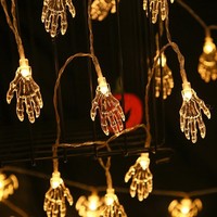 Lumières d'Halloween en stock : Décoration lumineuse en forme de main de squelette pour vitrine, étagère et cheminée