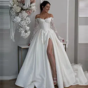 <span class=keywords><strong>Abiti</strong></span> <span class=keywords><strong>da</strong></span> Sposa di Lusso a Linea A, Sexy con Spalle Scoperte, Maniche in Pizzo, Maniche Lunghe, Spacco e Glitter - Product Image 1