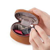 Nouvelle pochette souple à suspendre au cou pour pièces de monnaie, étui de rangement en cuir pleine fleur, mini sacs de voyage personnalisés à fermeture éclair ronde pour rouge à lèvres et maquillage