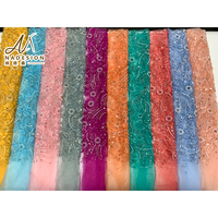 Tissu en dentelle de tulle brodé de fleurs 3D de qualité supérieure, tissu en maille orné de perles et de paillettes fait main pour les vêtements de mariage et d'occasions formelles
