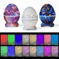 Projecteur de lumière nocturne LED mini moderne en forme d'œuf de dinosaure fissuré, projecteur d'étoiles avec télécommande, batterie rechargeable incluse