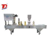 Machine de scellage pour contenant à lait ou yaourt, pour le remplissage de jus