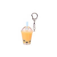 Porte-clés en acrylique attrayant rempli de liquide, avec logo et sangle personnalisables, idéal comme souvenir de marque pour les boutiques de bubble tea