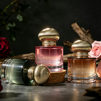 Flacon de parfum en verre rose rond épais de 50 ml, nouveau design, avec bouchon pompe transparent et boîte d'emballage cosmétique ronde verte, vente en gros