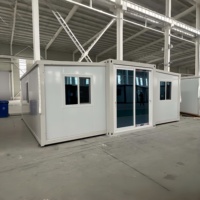 Maison conteneur préfabriquée à double aile extensible à installation rapide, abri d'urgence, unité d'hébergement temporaire pour les secours en cas de catastrophe