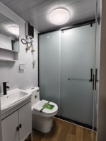 Maison conteneur extensible double face à structure en acier, à déploiement rapide pour l'hébergement sur chantier