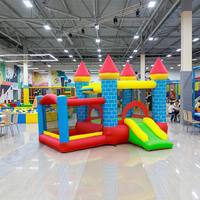 Château gonflable commercial avec toboggan, structure de saut en PVC robuste pour événements extérieurs et location commerciale