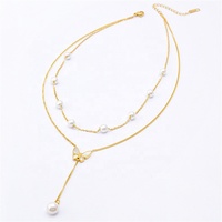 Collier Double couche en acier inoxydable pour femmes, bijoux tendance, en plaqué or, breloque perle et papillon, pendentif avec pompon, nouvelle collection