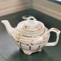 Vente chaude 7-Set Théière en porcelaine peinte à l'or Bouilloire en céramique au design moderne écologique pour un usage domestique Capacité de 1L