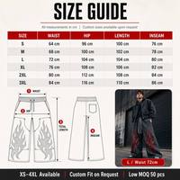 Pantalon de survêtement streetwear personnalisé avec logo, effet délavé, coupe oversize, strass, jambes évasées et superposées, imprimé flamme et broderie