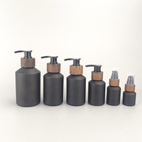 Flacon en verre noir mat à épaule inclinée 15 ml 30 ml 60 ml 100 ml 125 ml 200 ml Flacon cosmétique avec fermeture en bois