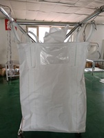 Sac FIBC tubulaire en PP de 1000 kg avec quatre boucles de levage sans soudure et bec de décharge pour le chargement et le déchargement automatisé de minerai dans les silos