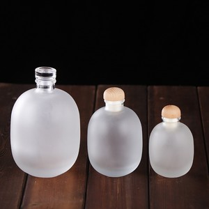 Wholesale 250ml 500ml Clear Frosted Wine Shochu <strong>Whiskey</strong> Vodka Sake Container Empty Round Glass Bottle <strong>With</strong> Cork for <strong>Honey</strong> - Product Image 1