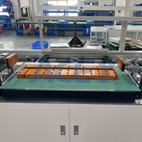 Machine de pressage, d'empilage et de cerclage manuelle pour batteries prismatiques, pour ligne d'assemblage automatique de batteries prismatiques