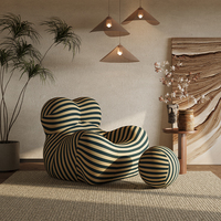 Fauteuil UP 50 Style Mamma's Hug, fauteuil lounge tout en mousse avec tissu rayé et ottoman en forme de boule