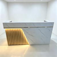 Comptoir de réception de salon de beauté de luxe haut de gamme avec éclairage LED et armoire de rangement