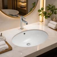 Lavabo de salle de bain d'hôtel ovale en céramique blanche à encastrer pour projets commerciaux