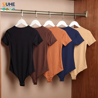 SUHE OEM ODM Combinaison moulante décontractée pour femme, manches courtes, col rond, extensible, entrejambe à boutons-pression, couleur unie, pour l'hiver et l'été