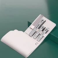 Kit de manucure et pédicure professionnel de luxe portable de haute qualité en acier inoxydable avec logo personnalisé et sac en cuir PU