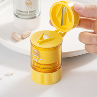 Mini déchiqueteuse de coupe-pilule en plastique portable avec organisateur de boîte de rangement ronde Matériau PP pour une gestion pratique des pilules
