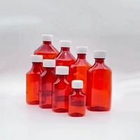 Bouteille graduée pour sirop aux fruits infusés, avec étiquettes personnalisées pour saveurs variées, idéale pour médicaments liquides