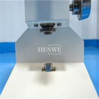 Machine de remplissage liquide manuelle Henwi A01 One Nose 5-50ml pour petites bouteilles d'huile essentielle, de parfum et de sérum.