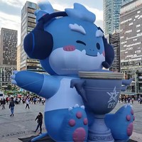 Grande mascotte gonflable de dragon de dessin animé pour l'extérieur avec trophée personnalisé pour les événements de jeu et les cérémonies de remise de prix