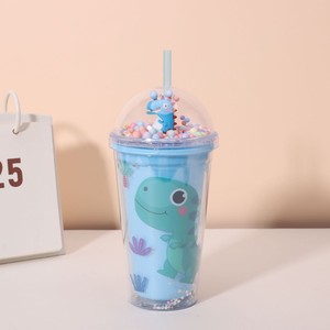 Lovely 450ml Four Pastel Color Cartoon Dinosaur Themed Double Wall Plastic Straw Tumbler with Decorative Multicolor Pom Pom Fill - Product Image 1