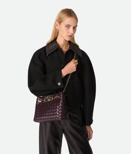 Petit sac à main Bottega Andiamo en cuir Intrecciato souple avec détail de nœud signature et cuir tubulaire Veneta - Product Image 1