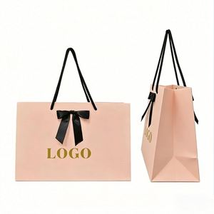 Factory Direct Customizable Free Design <b>Blush</b> Pink Paper Gift <b>Bag</b> With Bow Handle Luxury Ideal for Clothing & Gifting Packaging - Product Image 1