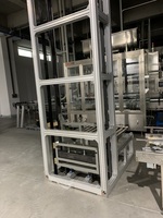 Système de levage de palettes/caisses, élévateur, système de transfert vertical, convoyeur