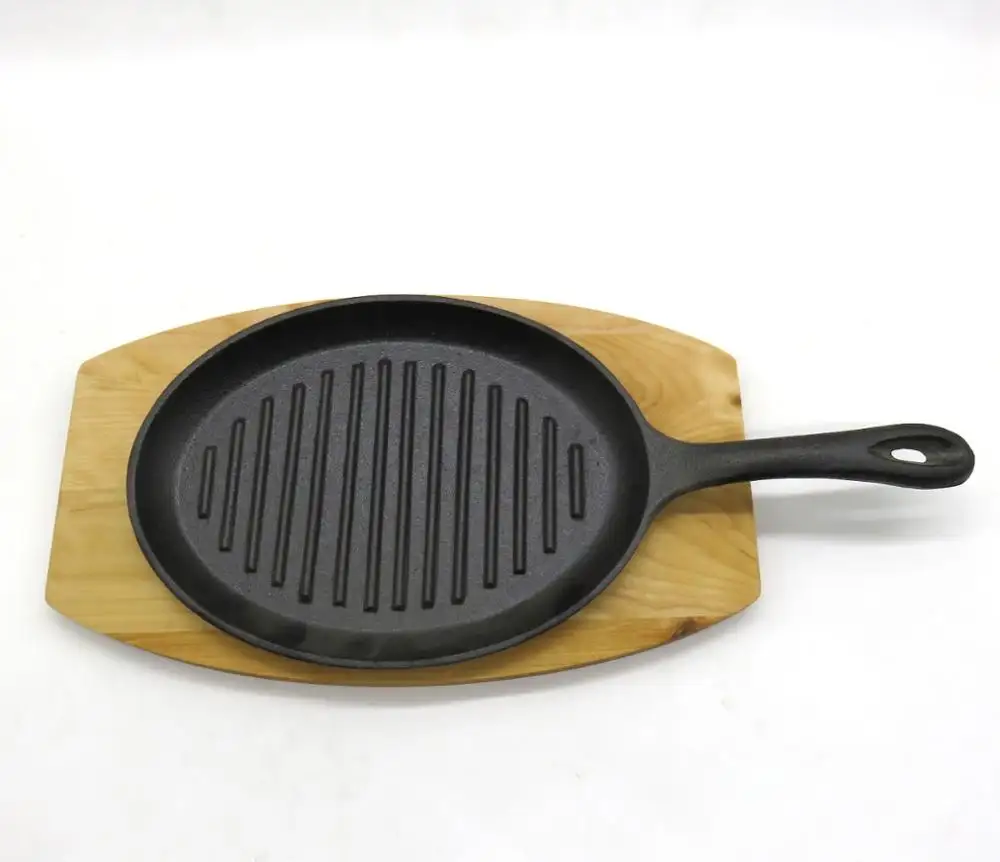 Plateau sizzer ovales en fonte, avec Base en bois/ustensiles de cuisine