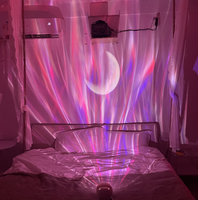 Projecteur d'étoiles Aurora en promotion avec haut-parleur Bluetooth rechargeable par USB, effet d'ondulation dynamique et veilleuse lune pour chambre d'enfant