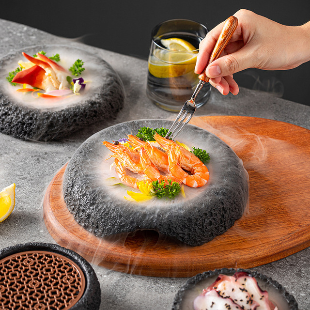 Artisanal black volcanic rock plate for upscale Japanese restaurant food display