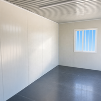 Garage préfabriqué gris détachable à assemblage rapide, directement de l'usine, avec porte à enroulement ouverte pour le stockage