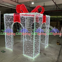 Tunnel lumineux géant LED en forme de boîte cadeau de Noël pour décoration extérieure de centres commerciaux, places publiques et points photo
