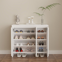 Meuble à chaussures en bois sur mesure avec tiroirs inclinés pour projets hôteliers et d'appartements