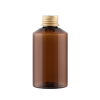 Flacons d'échantillons de 50 ml, 100 ml, 200 ml, 500 ml vert foncé à épaule inclinée pour hydrolats et toniques avec bouchon pompe en plastique pour liquides et médicaments