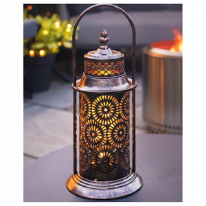 Linterna marroquí decorativa con tallas geométricas de metal, ideal para agregar carácter y luz suave a los hogares globales - Product Image 1